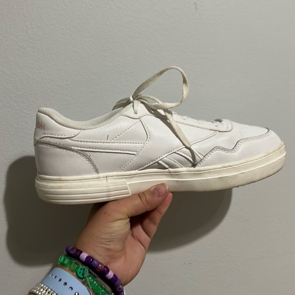 White reeboks with pink detailing